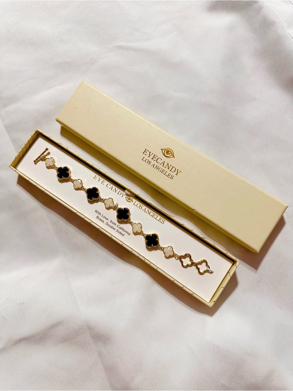 eye candy Gold-Tone Bracelet with Black and Cream Clover Links